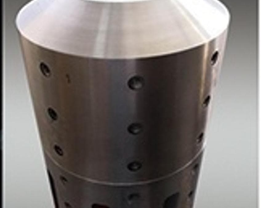 Conical outlet screen with machined slots, standing on the bench