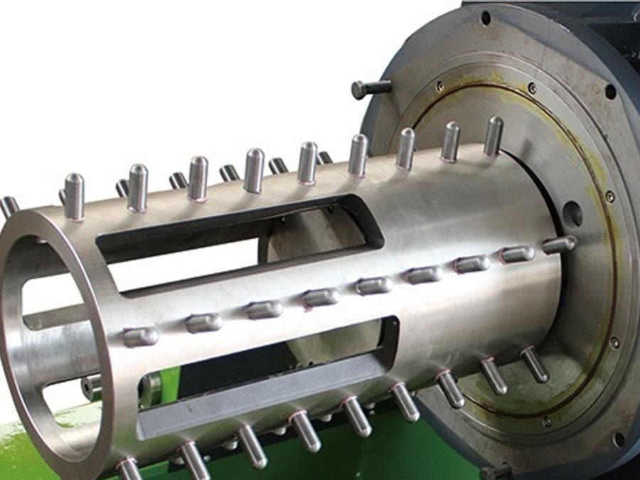 Rod-pin rotors and their sleeve stock laid out on the machining table