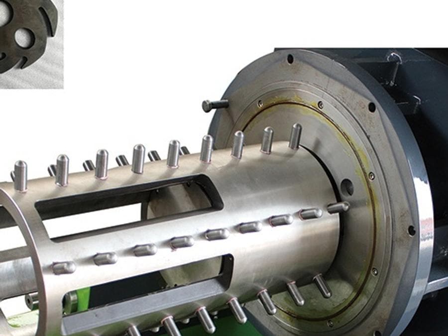 Rod-pin grinding rotor: a stainless cage with pressed pins, shown beside its wear sleeves